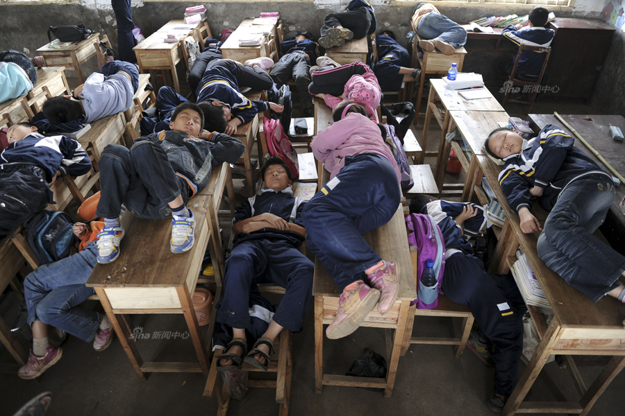taking a afternoon nap on school desks and chairs