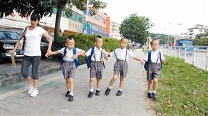 quadruplets are numbered for identification in school