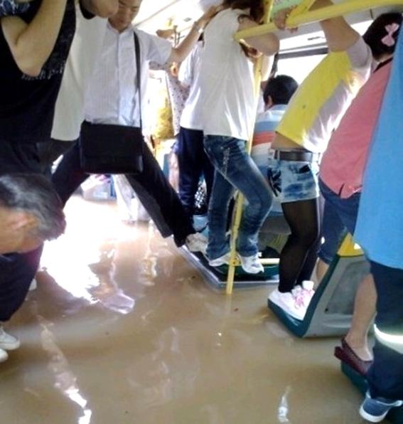 passengers in a bus in water
