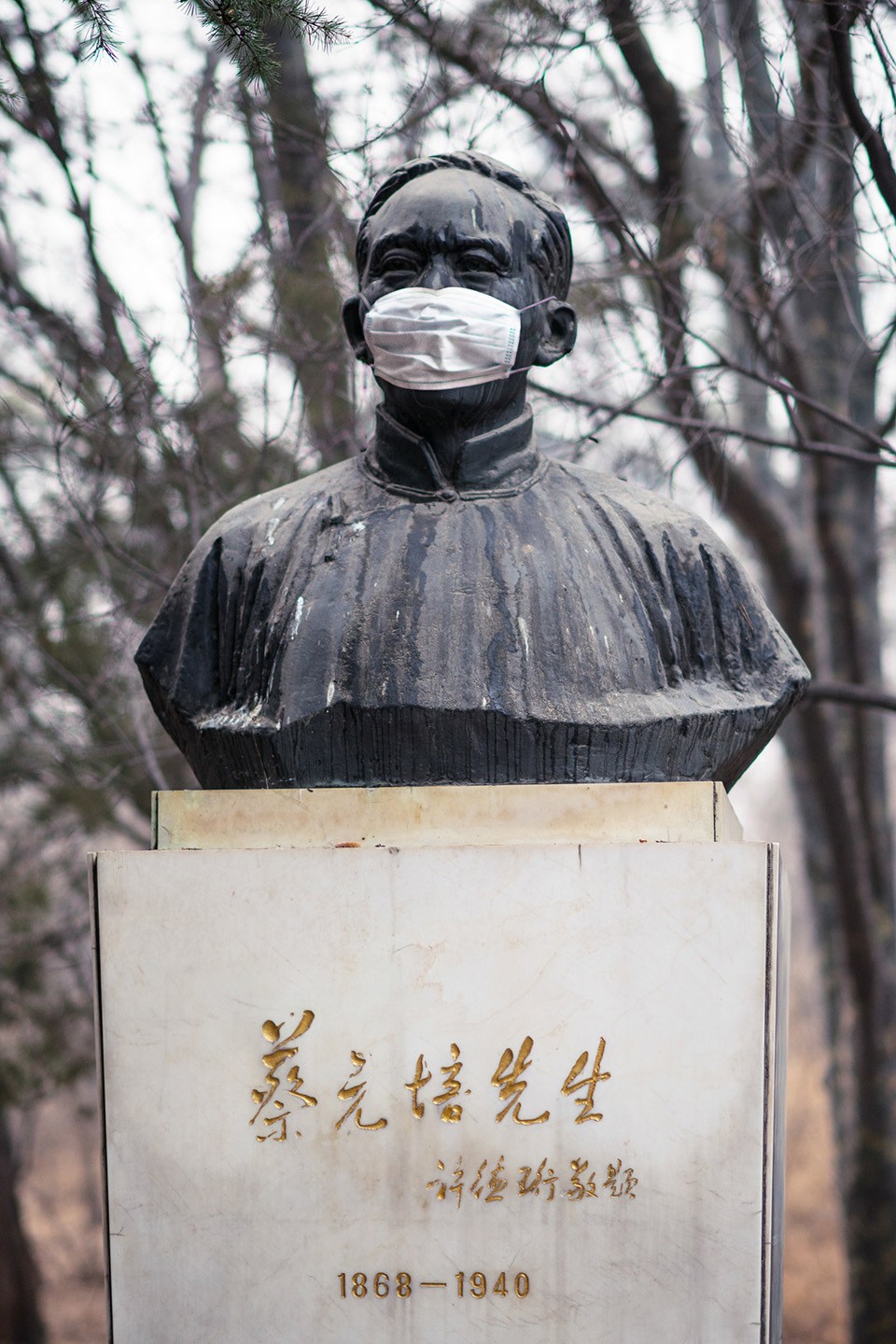 beijing university statues are masked for air pollution