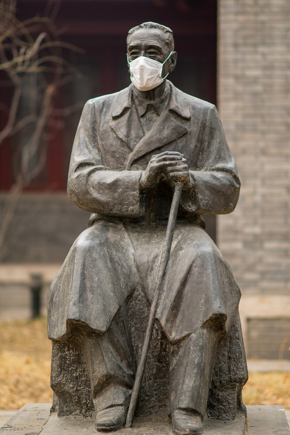 masked statues on campus of beijing