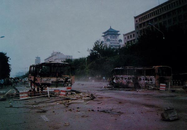 pictures about 1989 tiananmen square incident, buses are burned during on Beijing street