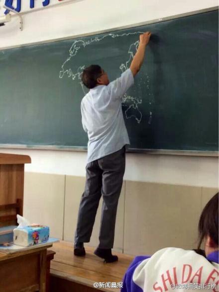 teacher draws a map on black board before class