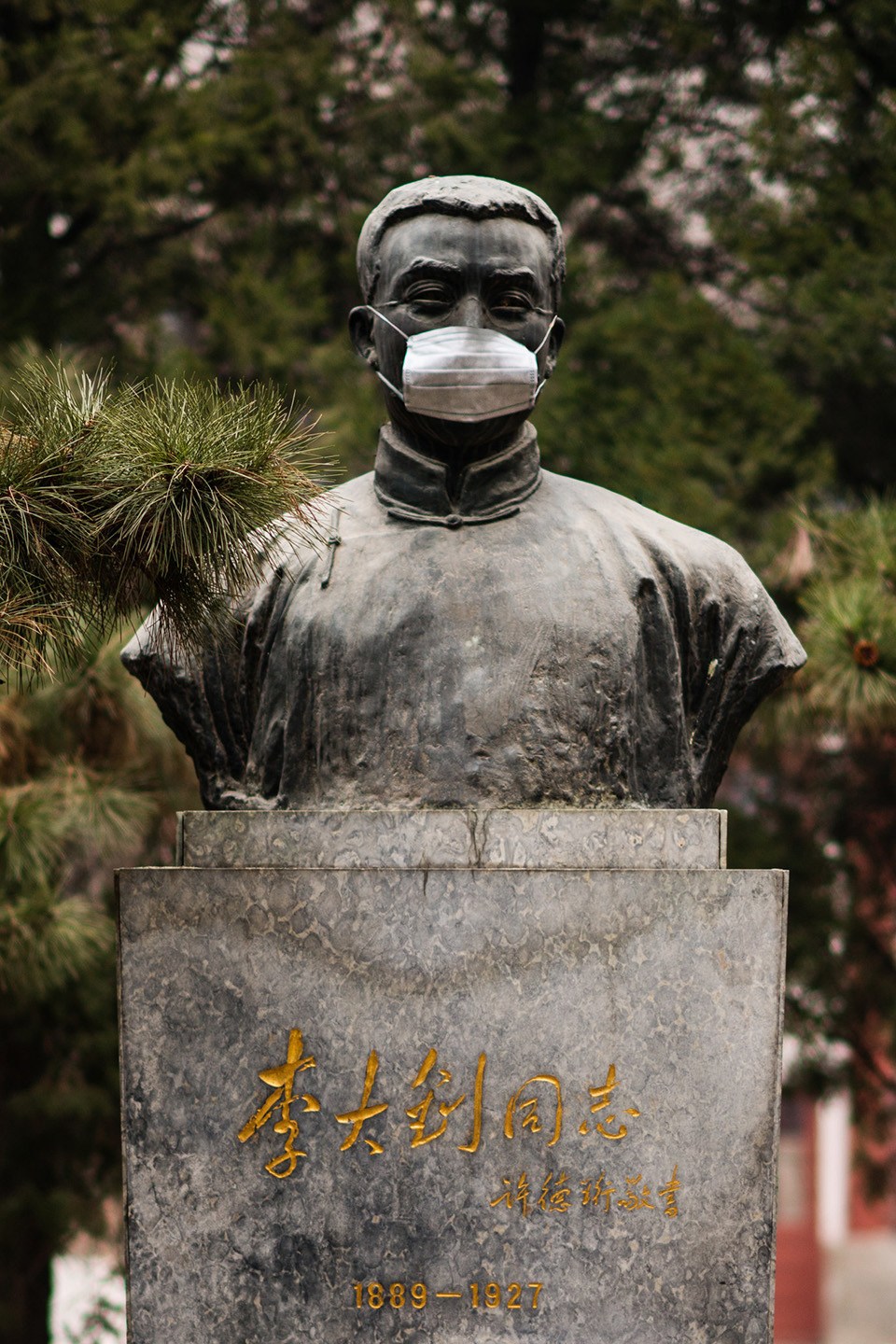beijing university statues are masked for air pollution