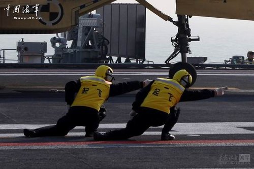 a cool gesture directing taking off on carrier imitated by many Chinese