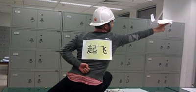 gesture of ground crew directing taking off from China's 1st carrier imitated by many Chinese