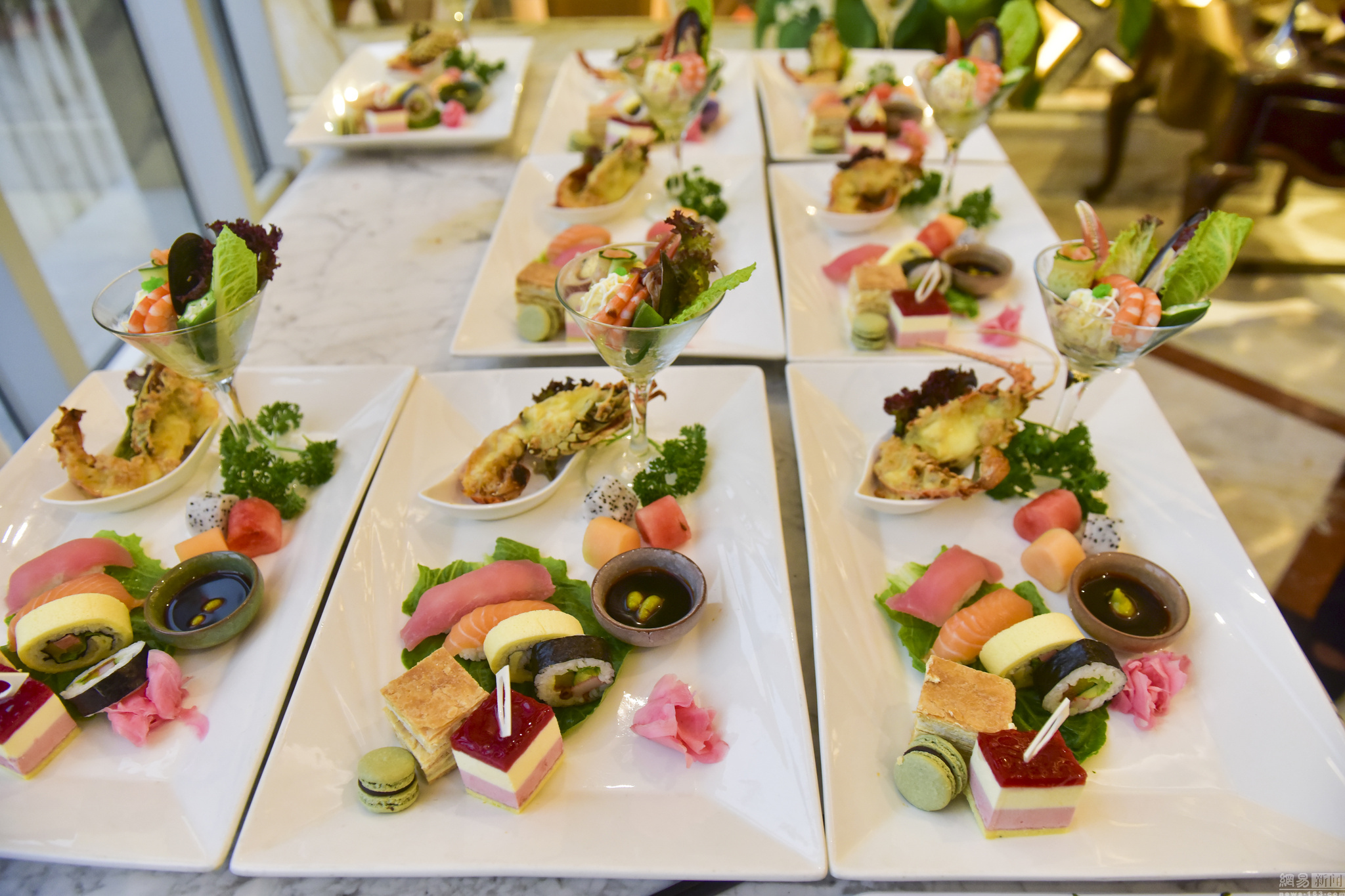 The menu of the dinner appears to be quite delicious, including fish, shrimp, and red wine. 