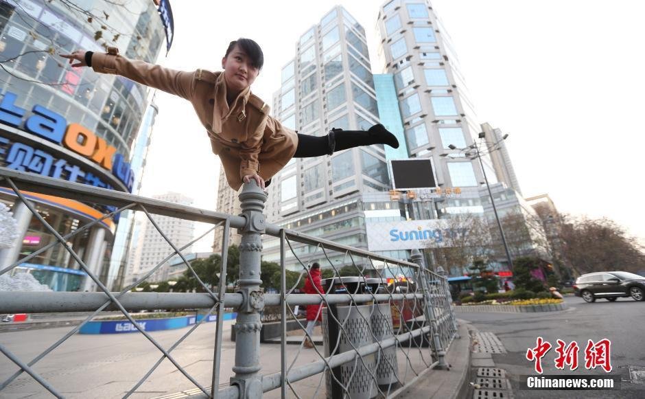 a girl is playing balance skills on street